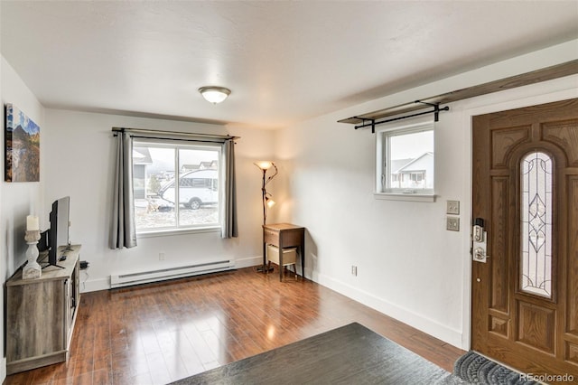 foyer featuring dark wood-type flooring and a baseboard radiator