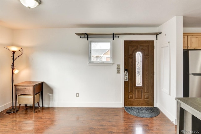 entrance foyer with dark hardwood / wood-style floors