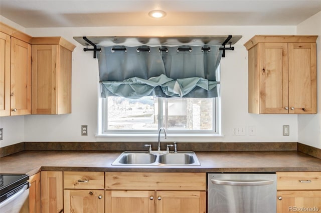 kitchen featuring stainless steel appliances, sink, and light brown cabinetry