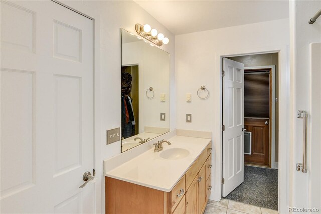 bathroom with vanity and tile patterned flooring