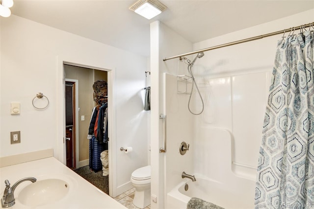 full bathroom with tile patterned flooring, vanity, shower / bath combo with shower curtain, and toilet