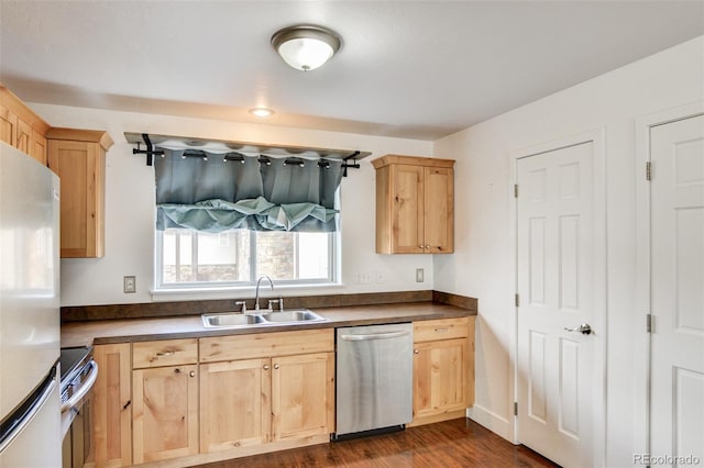 kitchen featuring dark hardwood / wood-style flooring, appliances with stainless steel finishes, sink, and light brown cabinetry