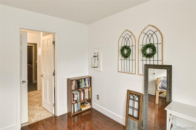 hall with dark hardwood / wood-style flooring