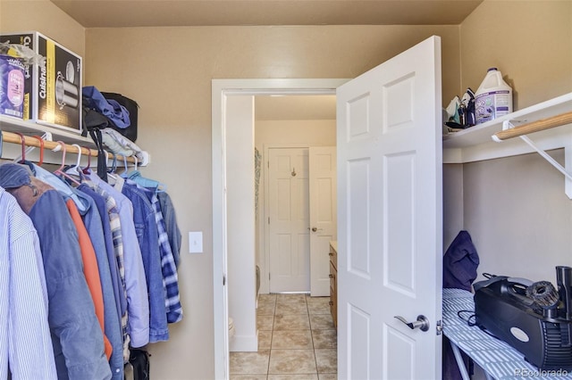 spacious closet with light tile patterned flooring