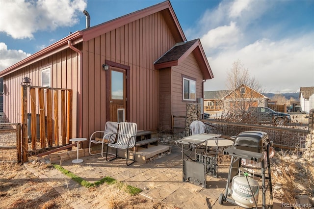 back of house with a patio