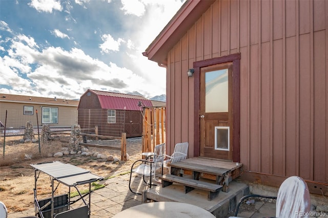 view of patio featuring an outbuilding