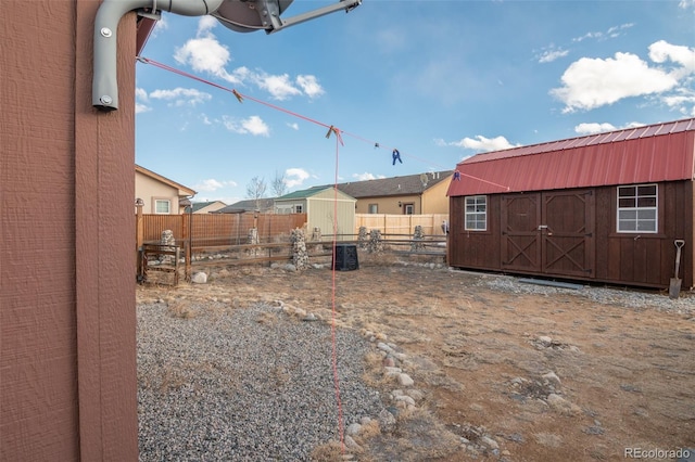 view of yard featuring a storage unit