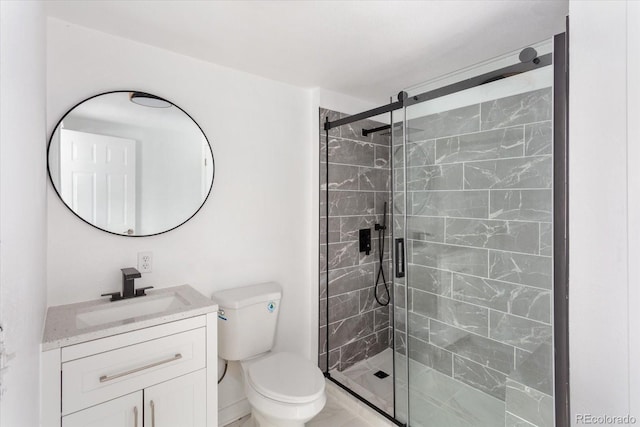 bathroom featuring vanity, toilet, and walk in shower