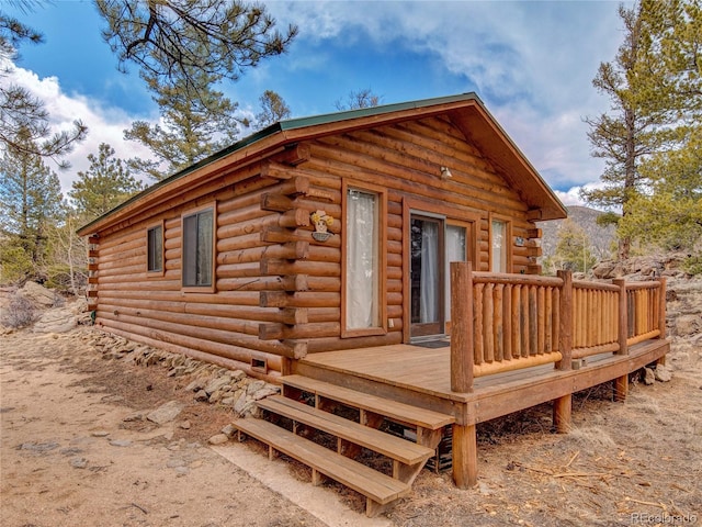 exterior space featuring a wooden deck