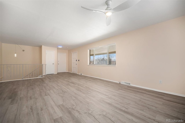 spare room featuring ceiling fan and light wood-type flooring