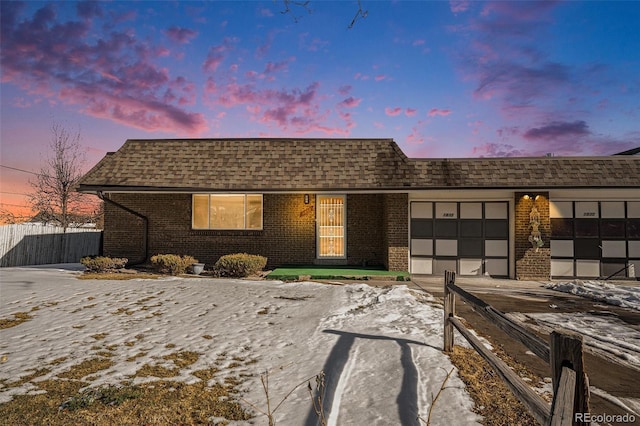 ranch-style house featuring a garage