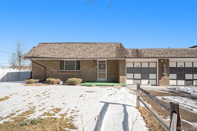 ranch-style house featuring a garage