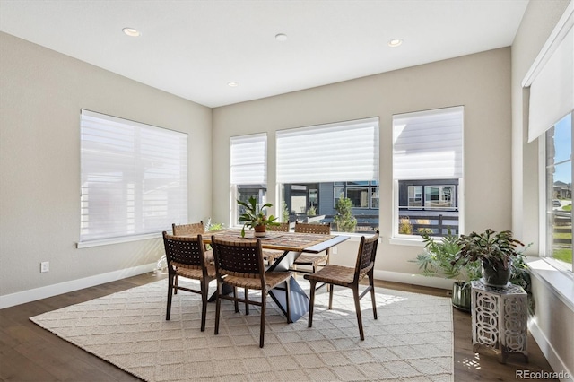 dining space featuring recessed lighting, dark wood finished floors, and baseboards