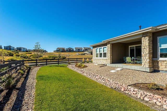 view of yard with a patio area and a fenced backyard