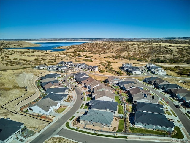 bird's eye view with a water view and a residential view