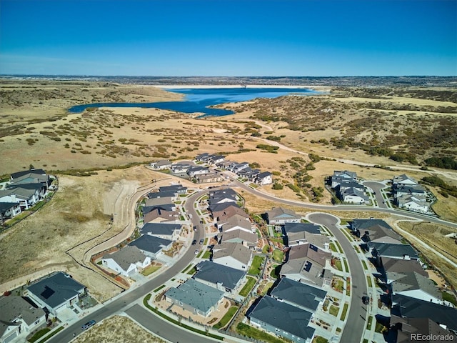 aerial view with a water view and a residential view