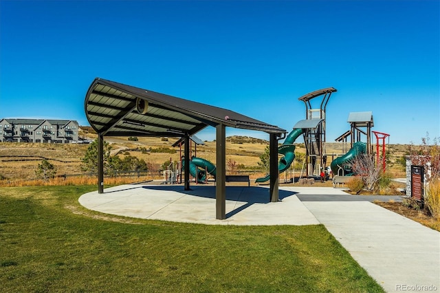 view of jungle gym featuring a lawn