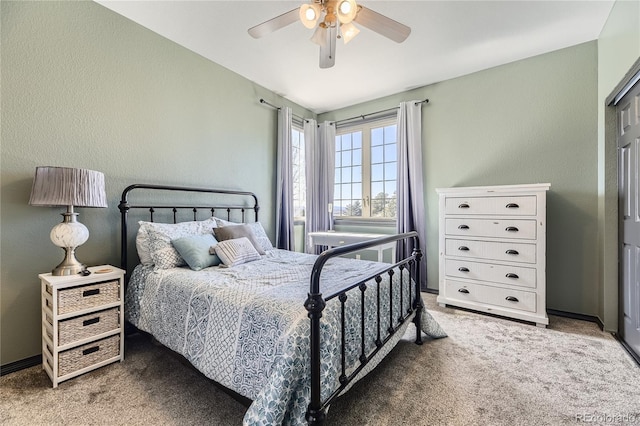 bedroom with baseboards, carpet, and a ceiling fan