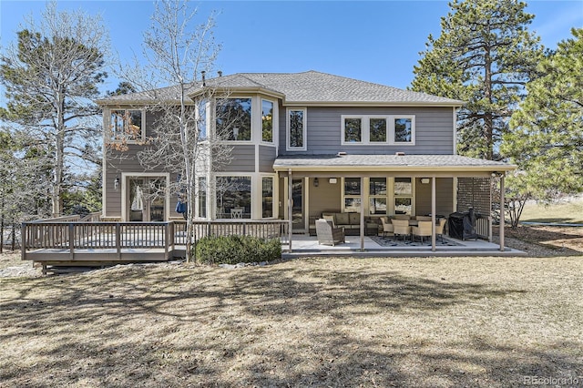 back of house featuring an outdoor hangout area, a patio, and a deck