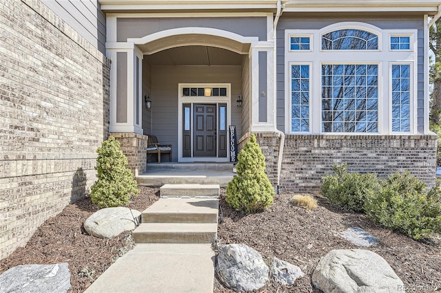 entrance to property with brick siding