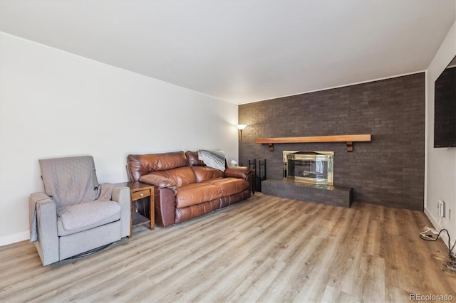 8445 Lamar Dr, Arvada, CO 80003 - living room with wood finished floors and a brick fireplace