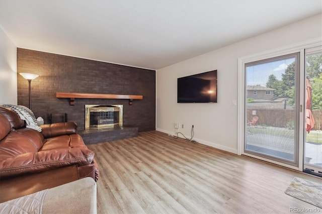 8445 Lamar Dr, Arvada, CO 80003 - living area with wood finished floors and a fireplace