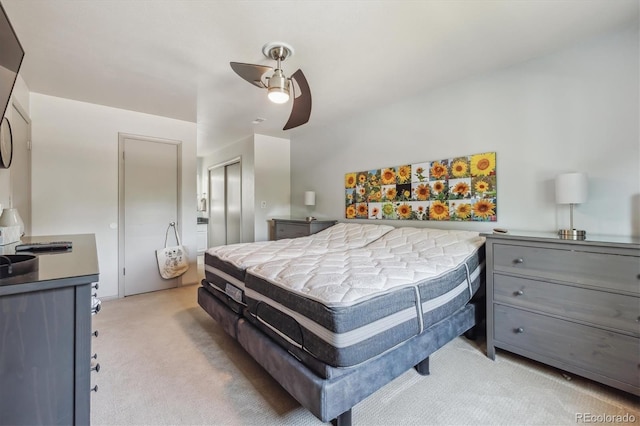 8445 Lamar Dr, Arvada, CO 80003 - bedroom featuring light carpet, a closet, and a ceiling fan