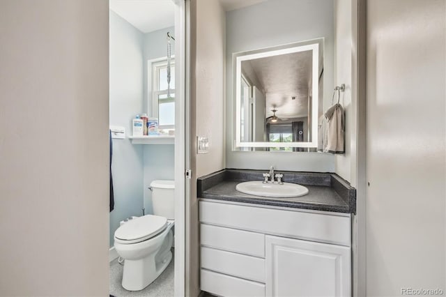 8445 Lamar Dr, Arvada, CO 80003 - bathroom featuring toilet and vanity