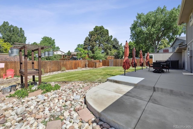 8445 Lamar Dr, Arvada, CO 80003 - fenced backyard with a patio area, a pergola, and outdoor dining area