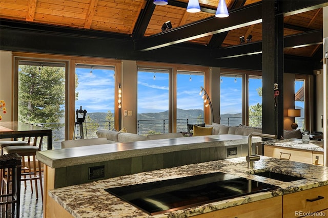116 Ramona Rd, Golden, CO 80403 - kitchen featuring a mountain view, wooden ceiling, black electric cooktop, a sink, and light stone countertops
