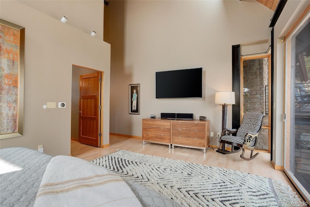 116 Ramona Rd, Golden, CO 80403 - bedroom with wood finished floors, access to outside, high vaulted ceiling, and baseboards