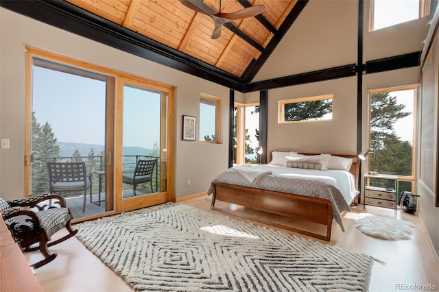 116 Ramona Rd, Golden, CO 80403 - bedroom featuring access to exterior, wood ceiling, high vaulted ceiling, beamed ceiling, and wood finished floors