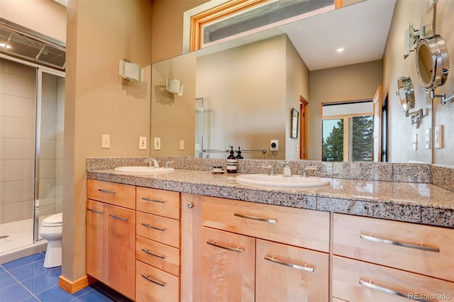 116 Ramona Rd, Golden, CO 80403 - full bath featuring toilet, a stall shower, double vanity, and tile patterned flooring