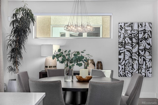 dining space with a chandelier