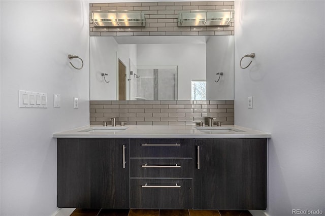 bathroom with tasteful backsplash, double vanity, and a sink