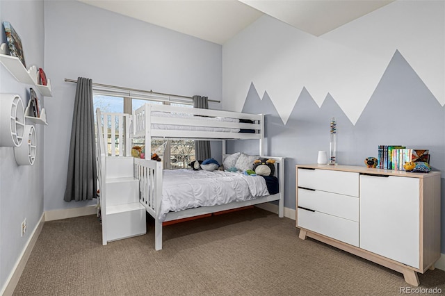 bedroom with baseboards and light carpet