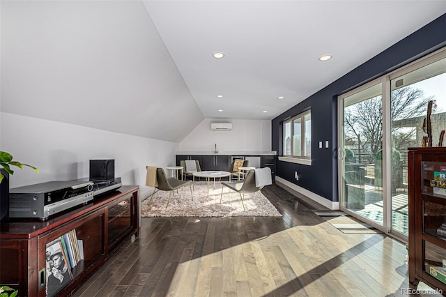 interior space featuring recessed lighting, wood-type flooring, and a wall mounted AC