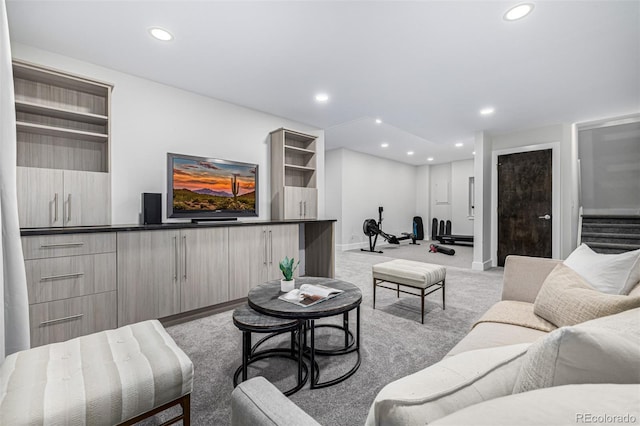 living room with stairs, recessed lighting, baseboards, and light carpet