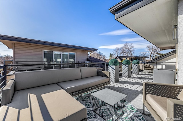 wooden terrace featuring outdoor lounge area