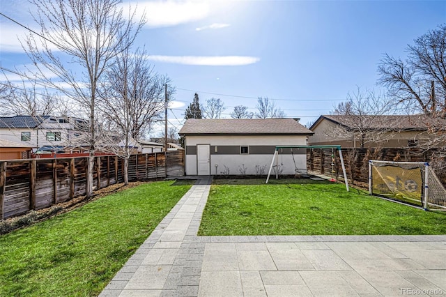 view of yard with a fenced backyard and a playground