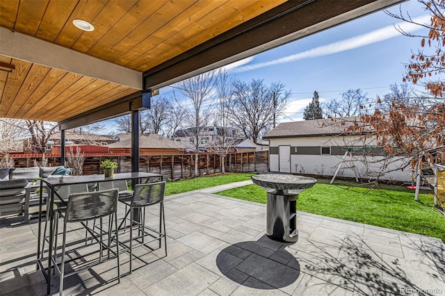 view of patio featuring a fenced backyard and outdoor dining space