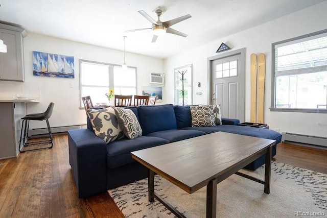 4312 Xavier St, Denver, CO 80212 - living room featuring baseboard heating, ceiling fan, wood finished floors, and a wall unit AC