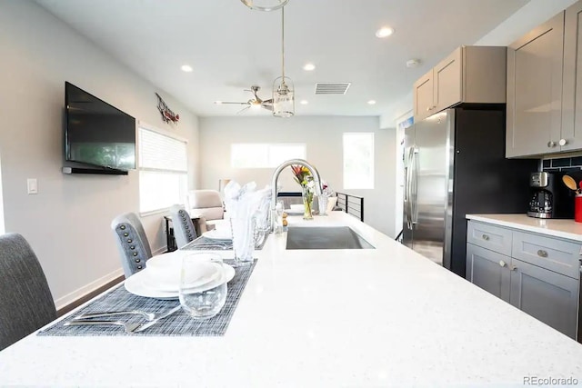 4312 Xavier St, Denver, CO 80212 - kitchen featuring a sink, light countertops, gray cabinetry, freestanding refrigerator, and recessed lighting