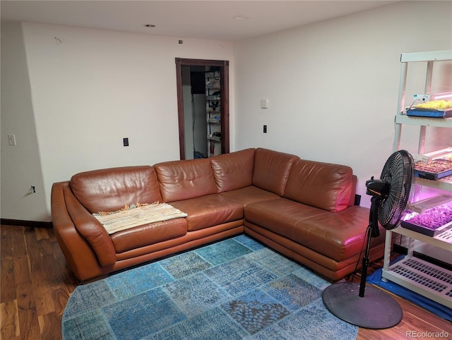 living room with wood finished floors and baseboards