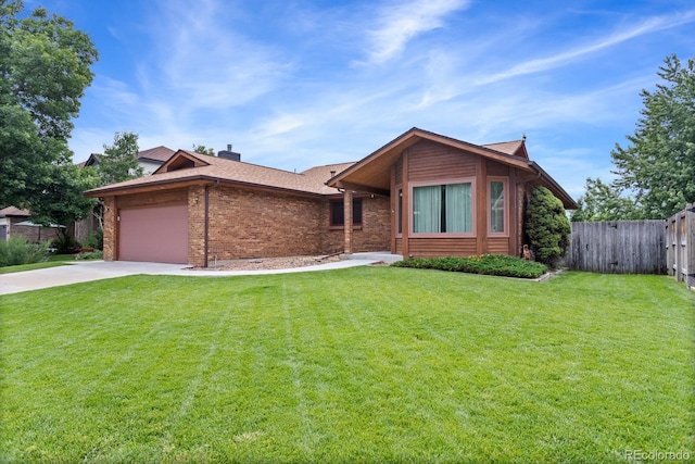 11686 W 74th Way, Arvada, CO 80005 - view of front of house with brick siding, a garage, driveway, a shingled roof, and a chimney