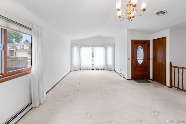 11686 W 74th Way, Arvada, CO 80005 - carpeted foyer with baseboard heating, vaulted ceiling, a chandelier, and healthy amount of natural light