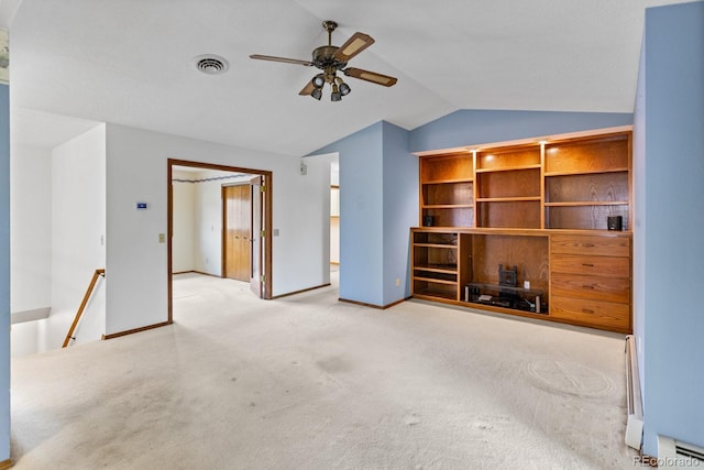 11686 W 74th Way, Arvada, CO 80005 - unfurnished living room with lofted ceiling, carpet floors, a ceiling fan, a baseboard heating unit, and a baseboard radiator