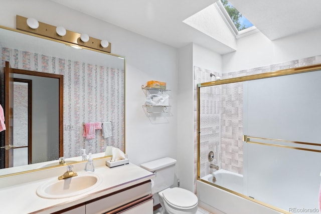 11686 W 74th Way, Arvada, CO 80005 - bathroom with a skylight, vanity, and shower / bath combination with glass door