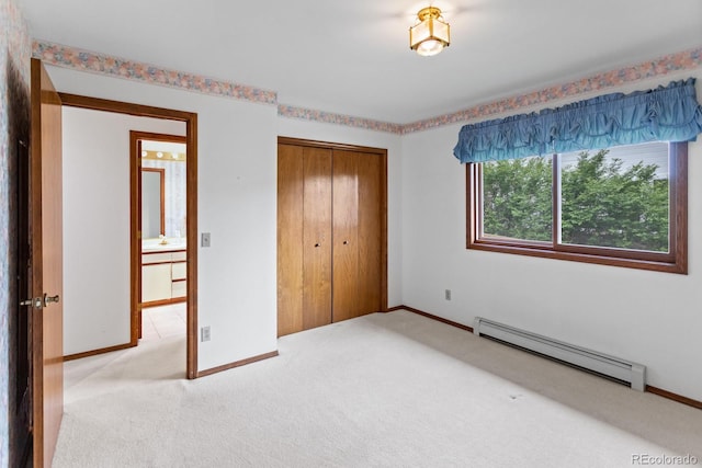 11686 W 74th Way, Arvada, CO 80005 - unfurnished bedroom with baseboard heating, light carpet, and a closet