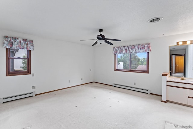 11686 W 74th Way, Arvada, CO 80005 - unfurnished bedroom with a baseboard heating unit, light carpet, and a ceiling fan